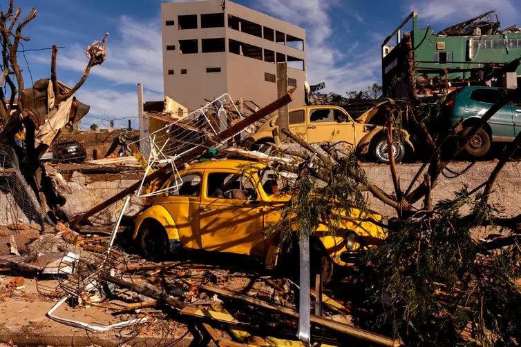 Debris lies on a vehicle at a damaged area after the tornado that hit Rio Bonito do Iguacu, in southern Parana state, Brazil November 9, 2025. REUTERS/Priscila Ribeiro